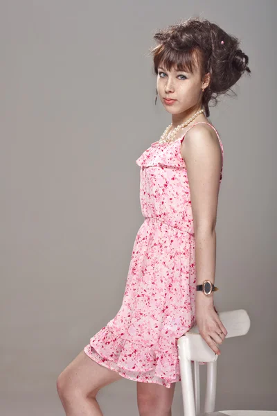 Beautiful girl in a pink dress — Stock Photo, Image