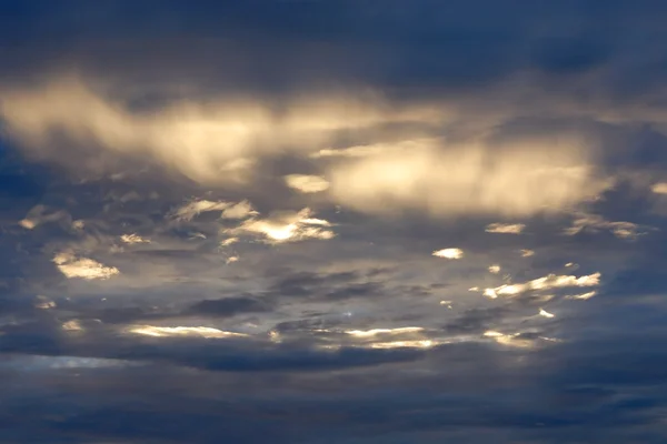 Clouds in a golden sunset — Stock Photo, Image