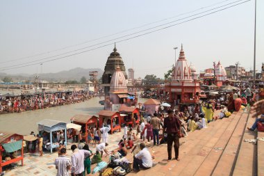 Bathing in the Ganges. The sacred city of Haridwar. North India. clipart