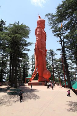 The statue of Hanuman in the temple Dzhakhu (Dzhakhu Mandir), Shimla, Northern India clipart