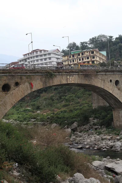 stock image A stone bridge over the river