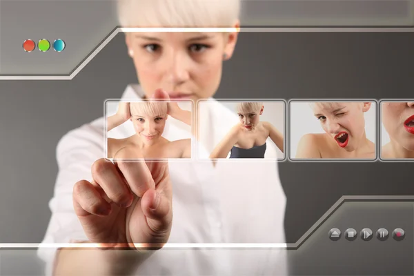 Girl choosing photo from touch screen - modern photography concept — Stock Photo, Image