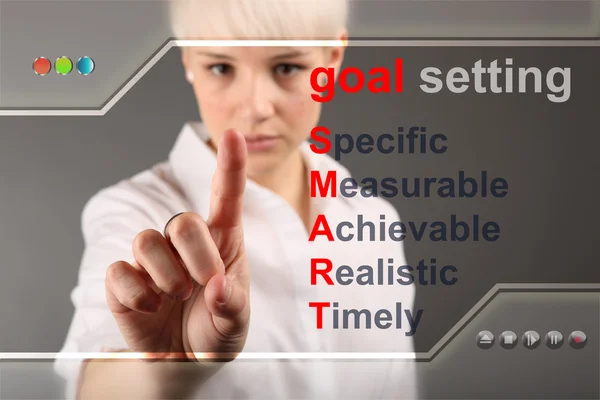 Goal setting concept - business woman touching screen — Stock Photo, Image