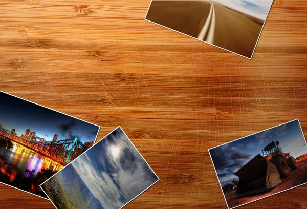 Photos on the wood desk — Stock Photo, Image