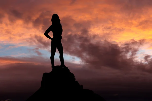 Silhouette at the top of the mountain — Stock Photo, Image