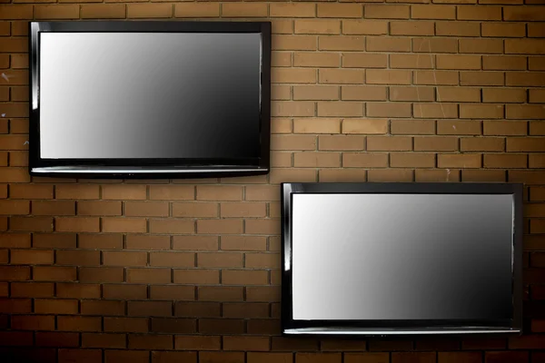Telewizorów plazmowych na ścianie — Zdjęcie stockowe