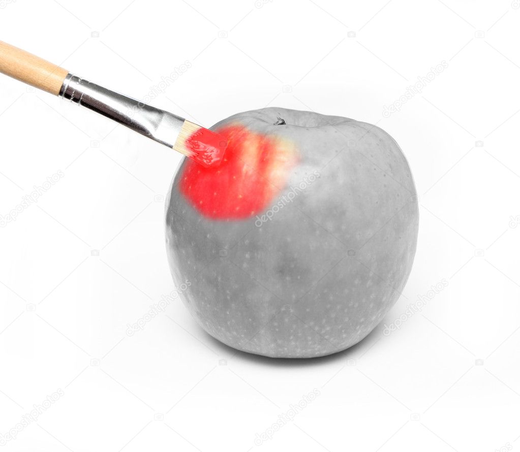 hand painting a fresh red wet apple - partly black and white and partly colored