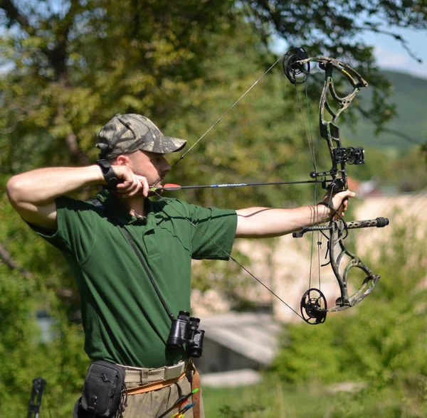 Modern bow hunter in the woods — Stock Photo, Image