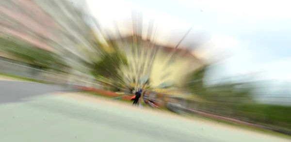 Blurred image of a man against the house — Stock Photo, Image