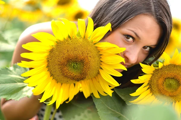 stock image Portrait of young woman with sunflowers