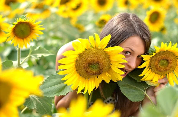 stock image Portrait of young woman with sunflowers