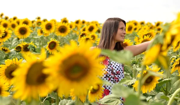 stock image Portrait of young woman with sunflowers