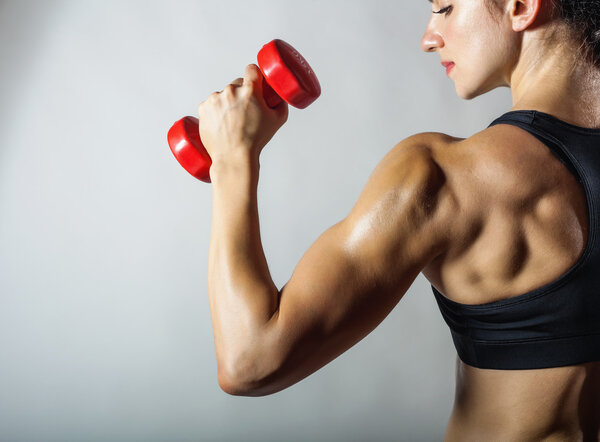 Fitness woman with barbells 