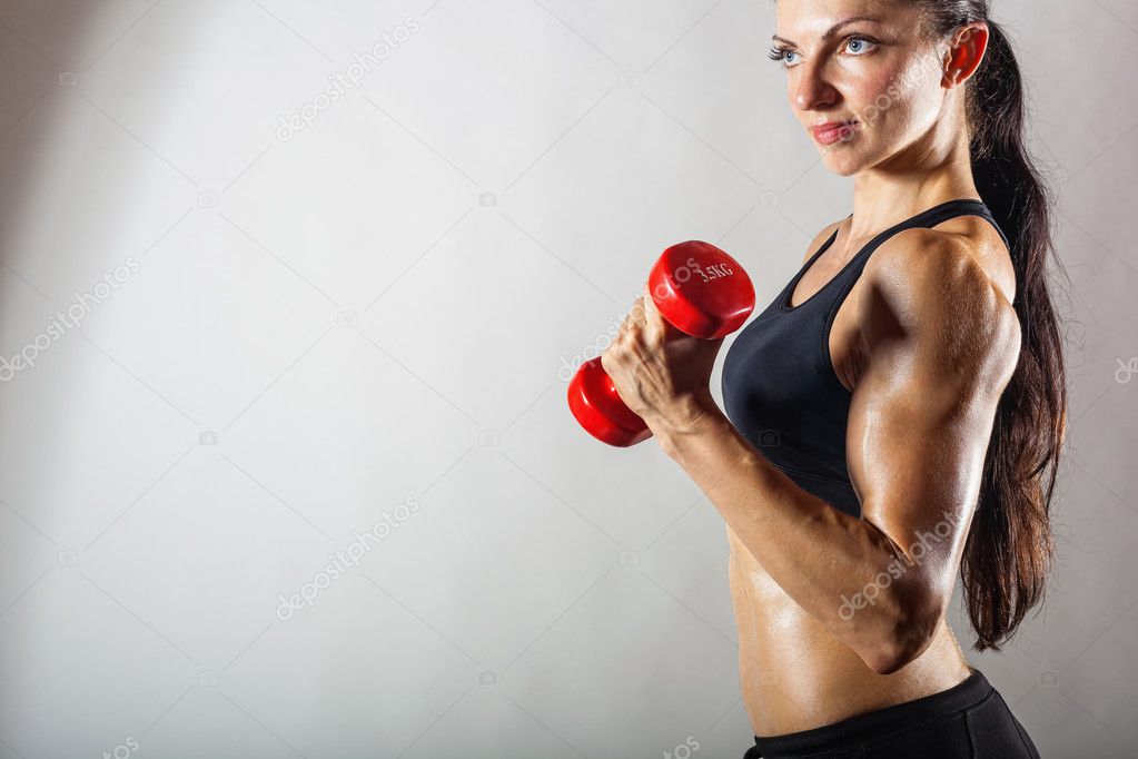 Fitness woman with dumbbells 