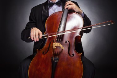 Cellist playing classical music clipart