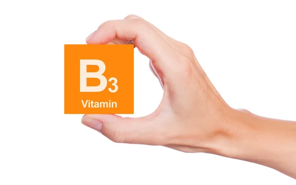Mão que segura uma caixa de vitamina B3 — Fotografia de Stock