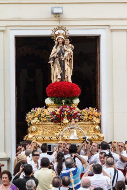 Virgen del Carmen getting out of the church clipart