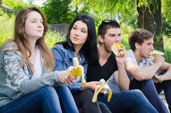 Row of friends sitting together — Stock Photo, Image