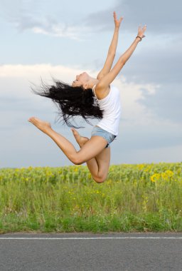 Ballerina leaping high in the air clipart