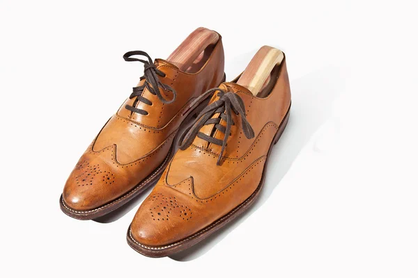 stock image A pair of tan fashionable mens brogue shoes