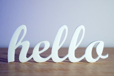 Hello Sign on Wooden Table clipart