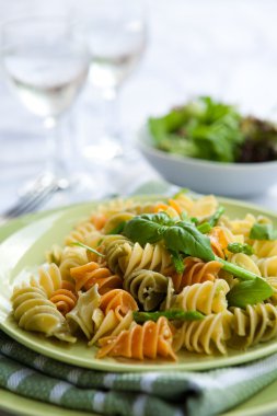 Plate of delicious pasta with asparagus and basil pesto clipart