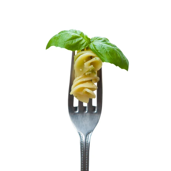 Isolated pasta and basil leaf on fork — Stock Photo, Image