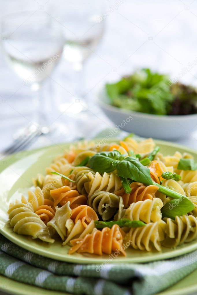 Plate of delicious pasta with asparagus and basil pesto