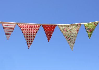 Country Bunting on blue sky clipart