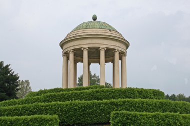 Ancient dome above the Hill of a public garden clipart