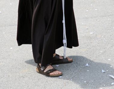 Barefoot with sandals and the habit of a Friar clipart