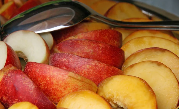 stock image Fresh peach slices served on a silver tray