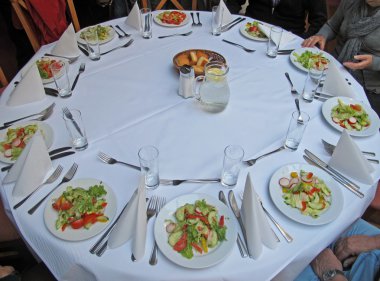 Restaurant with the tables prepared for the gala dinner clipart