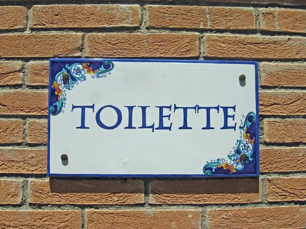 stock image Ceramic colorful sign with the indication of the toilet