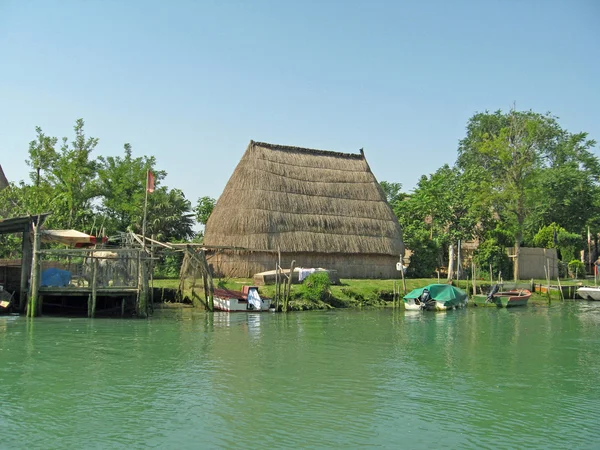 Stock image Old huts and piles of straw and wood where they dwelled fisherme