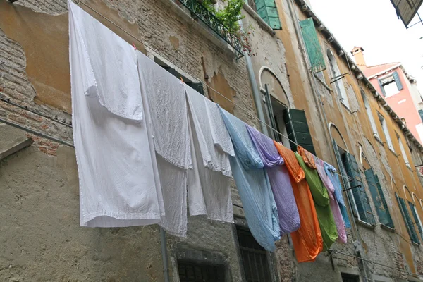 Drying laundry along a narrow street — Stock Photo, Image