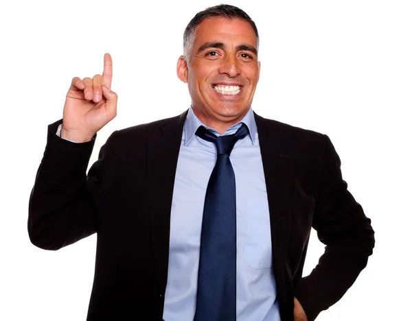 Hispanic senior businessman pointing up — Stock Photo, Image