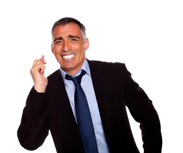 Friendly businessman crossing fingers — Stock Photo, Image