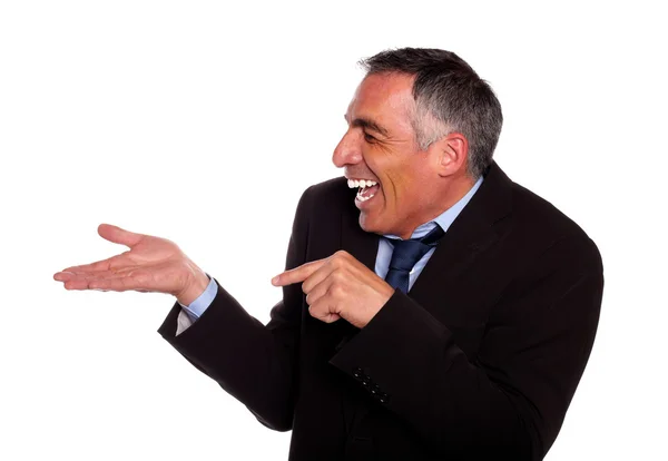 Geschäftsmann lacht und zeigt ausgestreckte Hand — Stockfoto