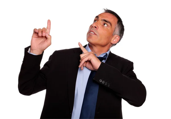 Hispanic senior businessman pointing up — Stock Photo, Image