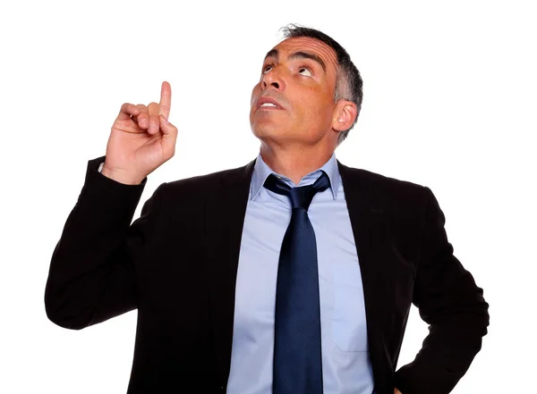Attractive executive looking and pointing up — Stock Photo, Image