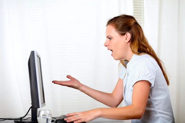Charming pretty surprised girl looking on computer — Stock Photo, Image
