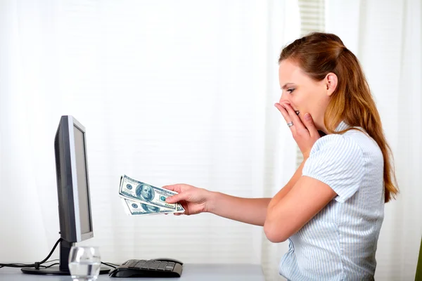 Surprised and excited girl with cash dollars — Stock Photo, Image
