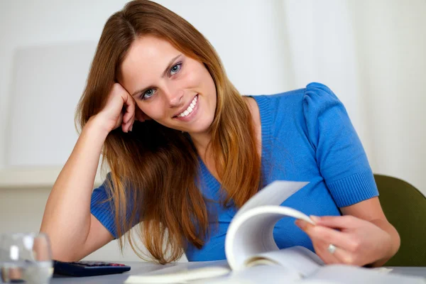 Lovely young female reading at home — Stock Photo, Image