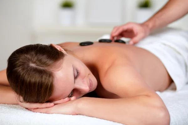 Tired young female relaxing at a spa — Stock Photo, Image