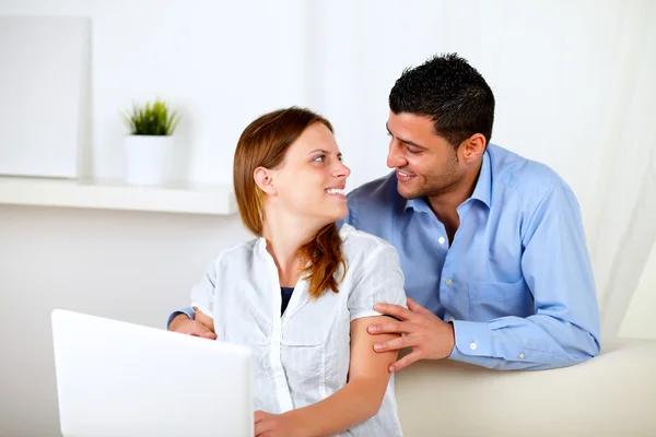 Couple in love using a laptop at home — Stock Photo, Image