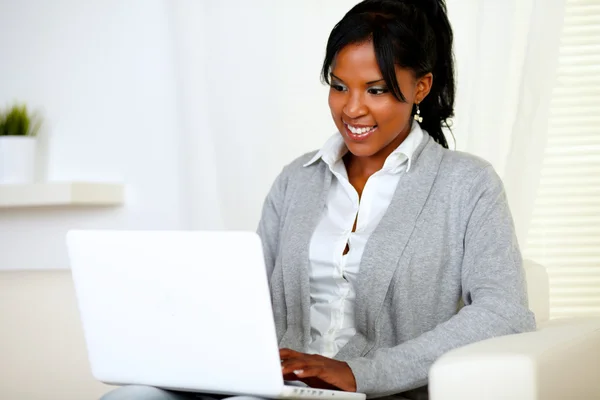 Smiling woman using laptop Stock Image