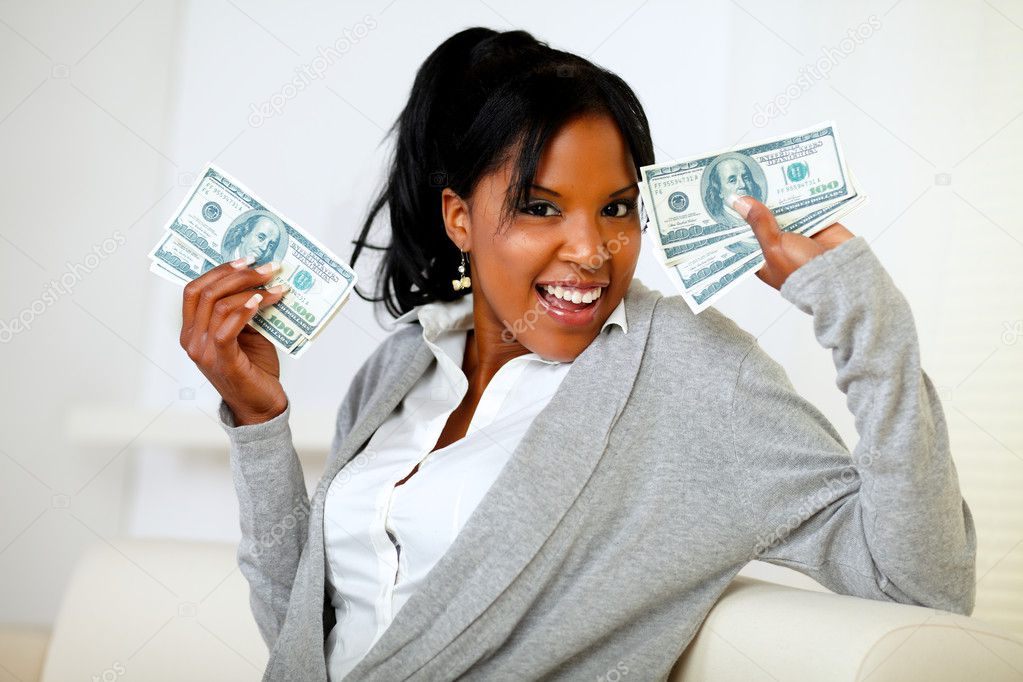 Afro-american girl holding plenty of cash money