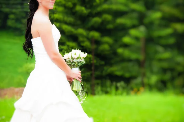 Bride in white dress with flowers without the face — Stock Photo, Image