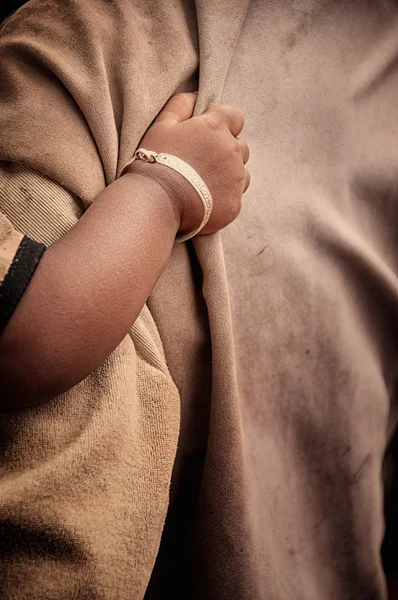 stock image Poor child's hand holding on to a man